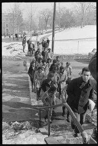 A group of Black students crosses the street on the way to the President's House